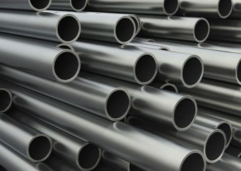 Stacked metal pipes close-up